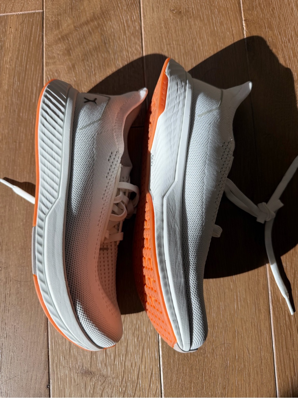 Puma Women’s White Athletic Sneakers with Orange Sole